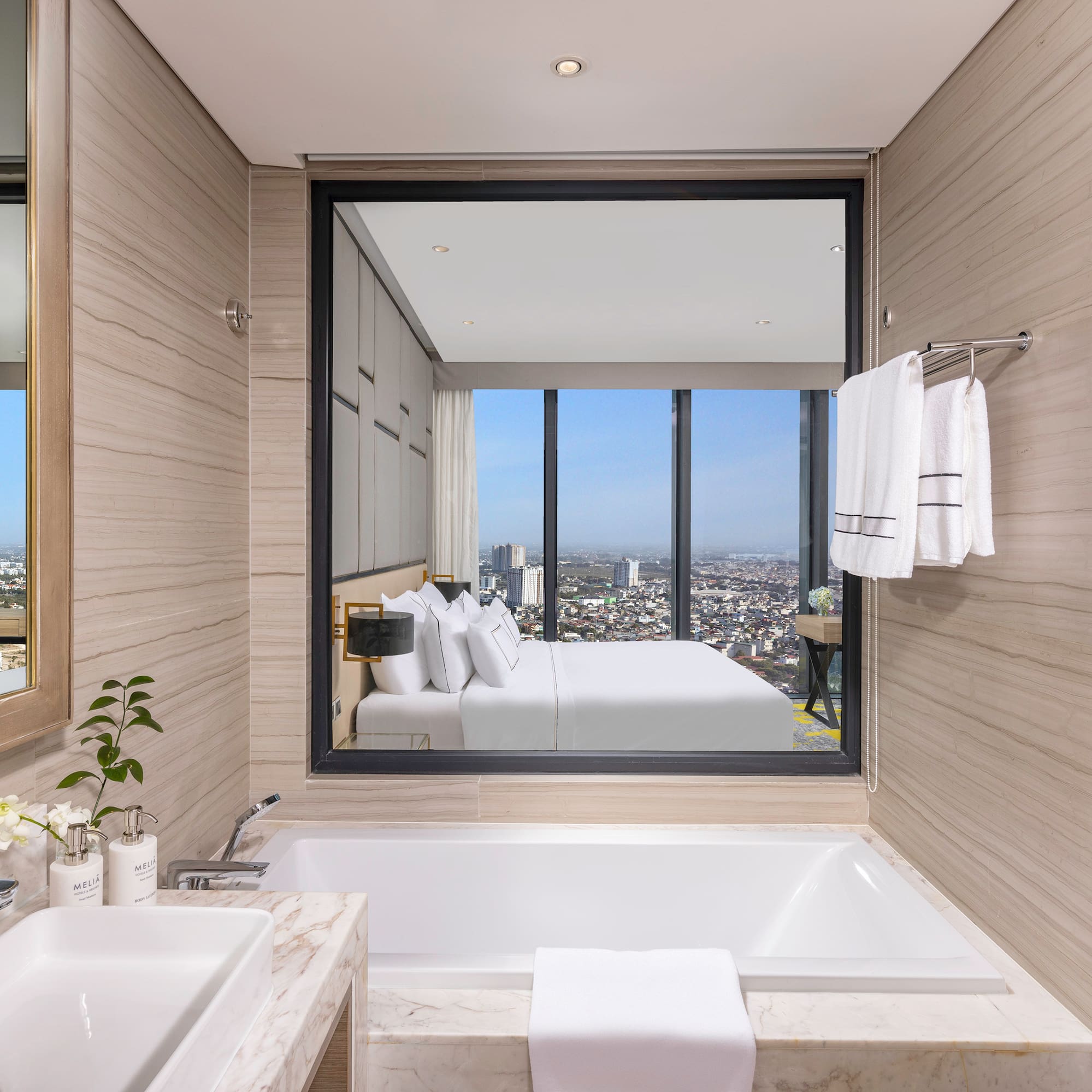 a bathroom with a large window and a bathtub