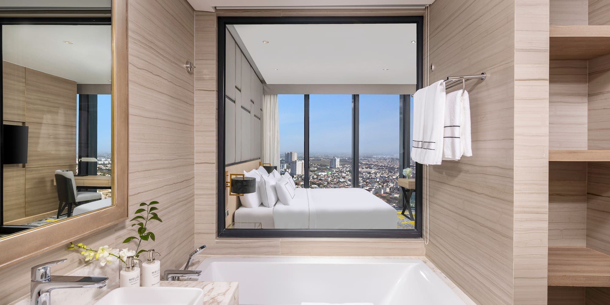 a bathroom with a large window and a bathtub
