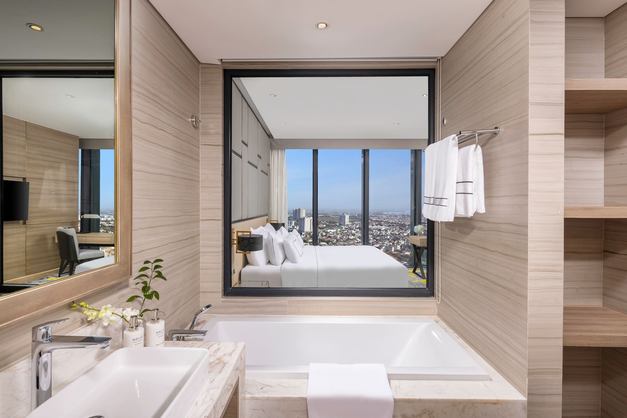 a bathroom with a large window and a bathtub