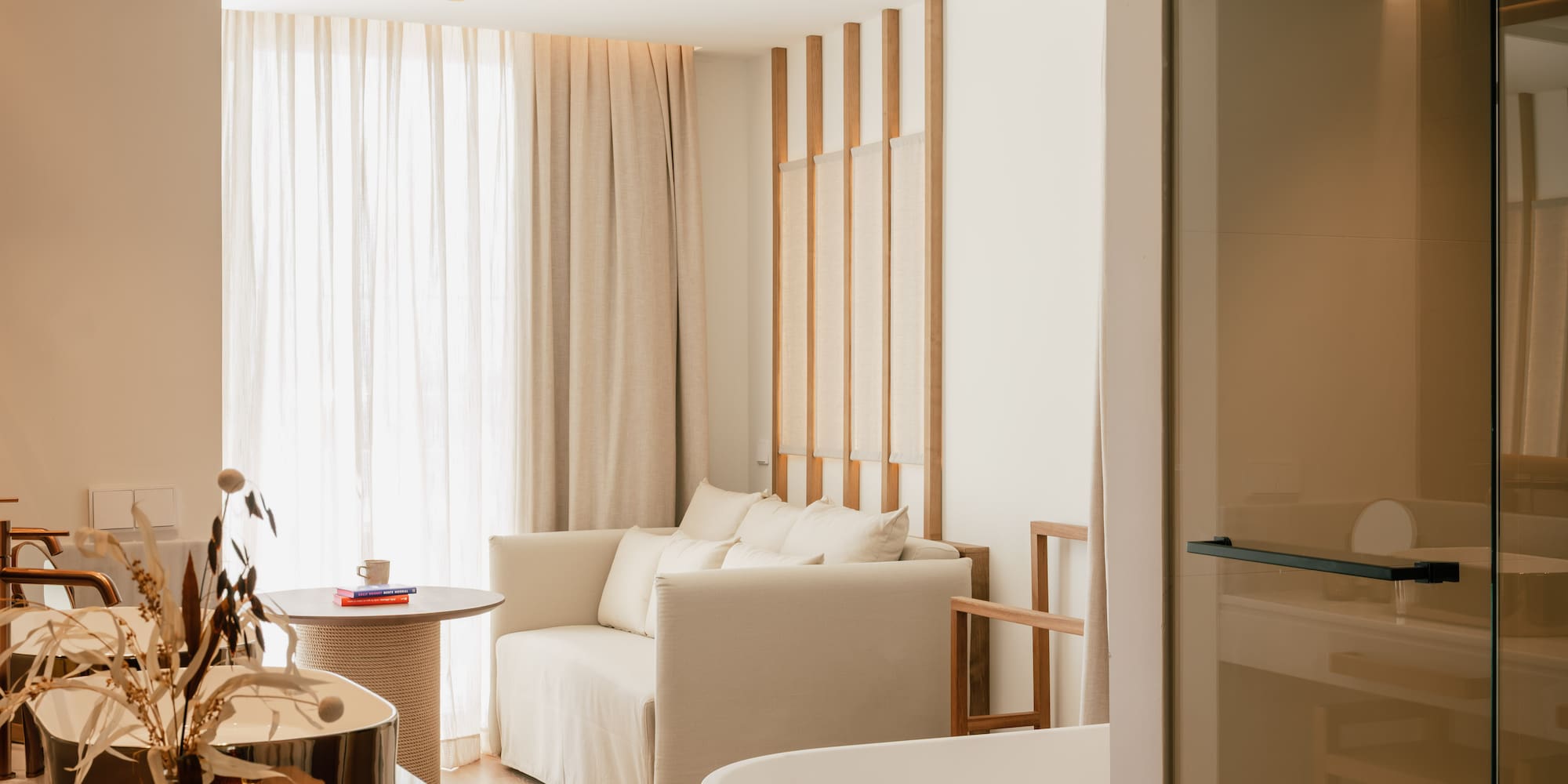 a room with a couch and bathtub