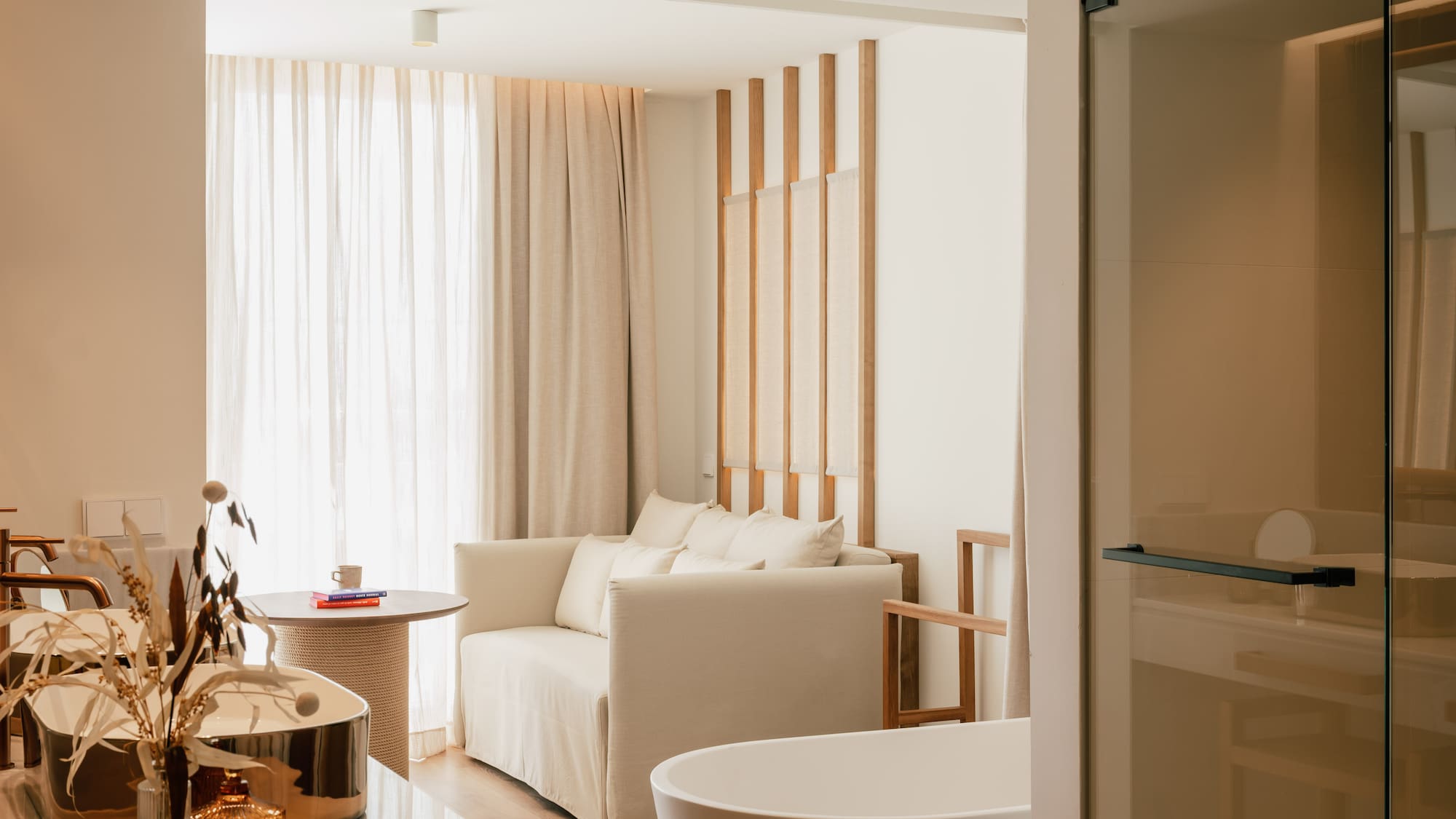 a room with a couch and bathtub