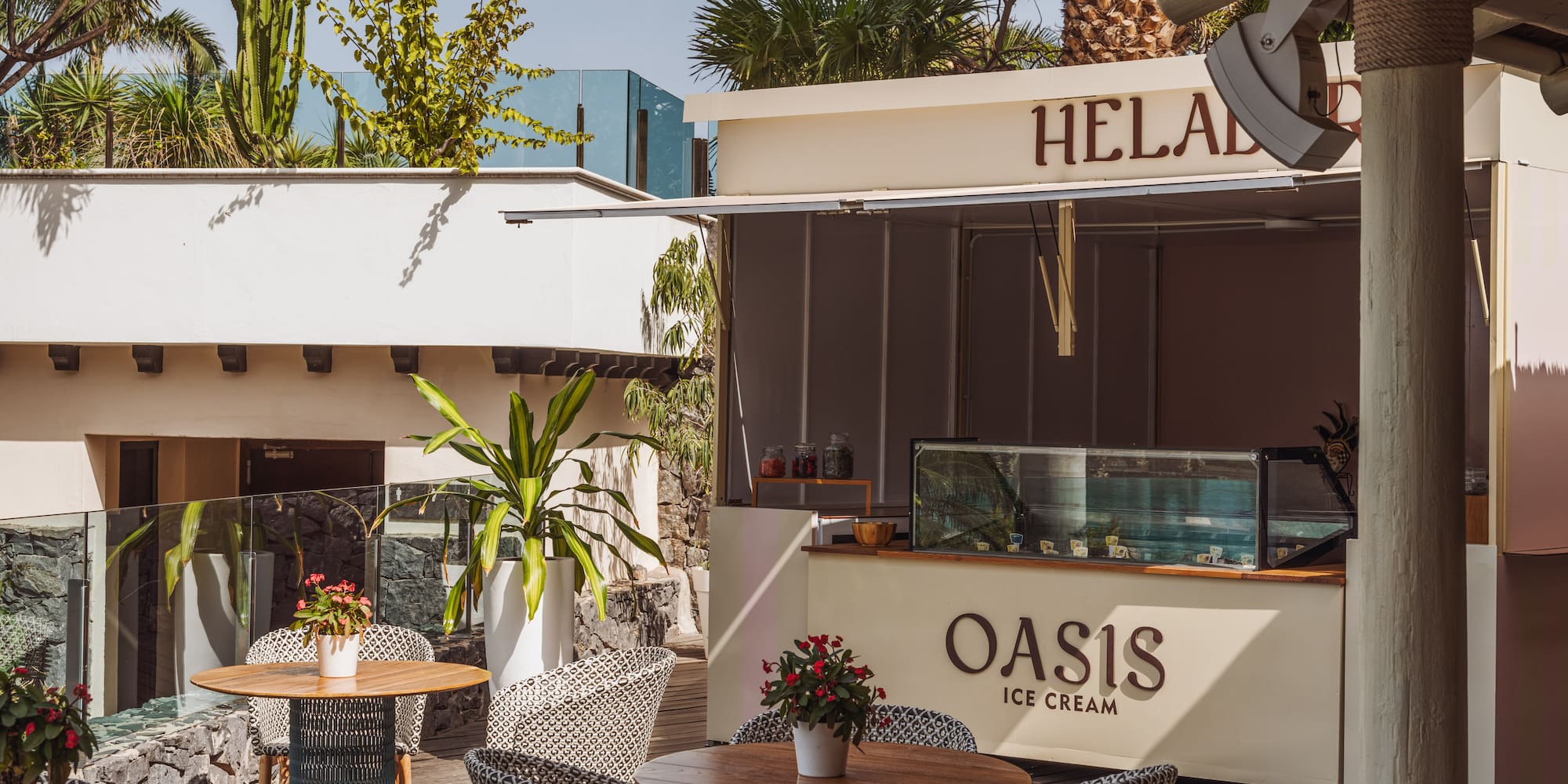 a patio with tables and chairs