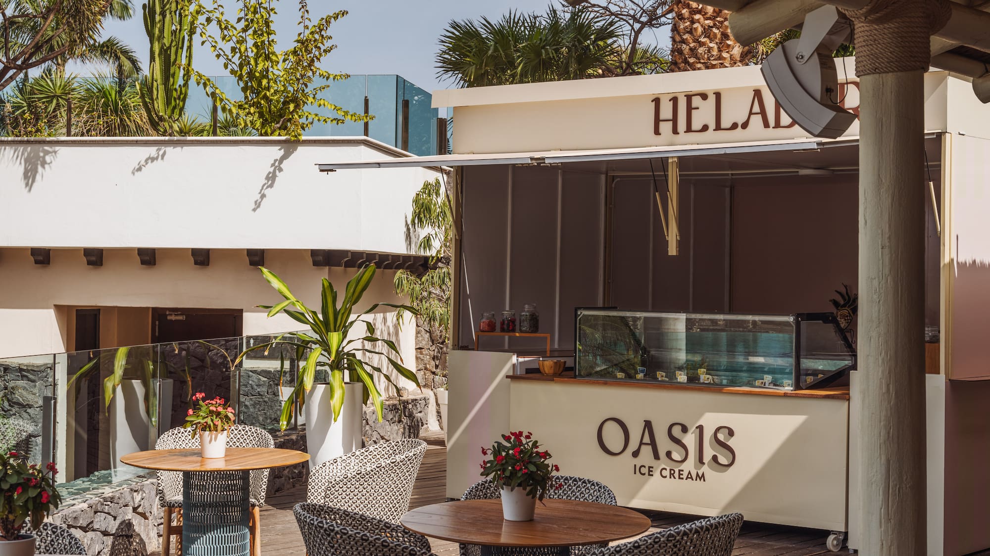 a patio with tables and chairs