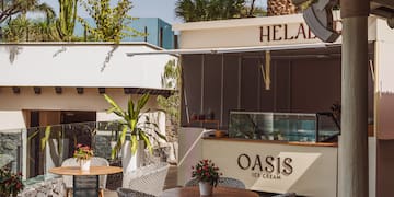 a patio with tables and chairs