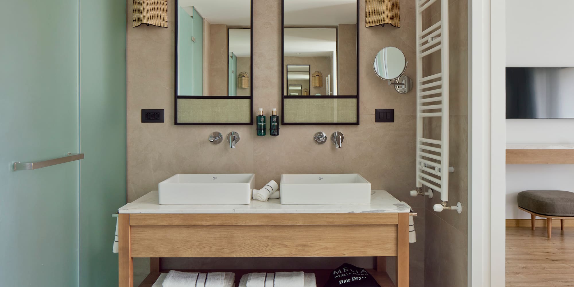 a bathroom with two sinks and mirrors