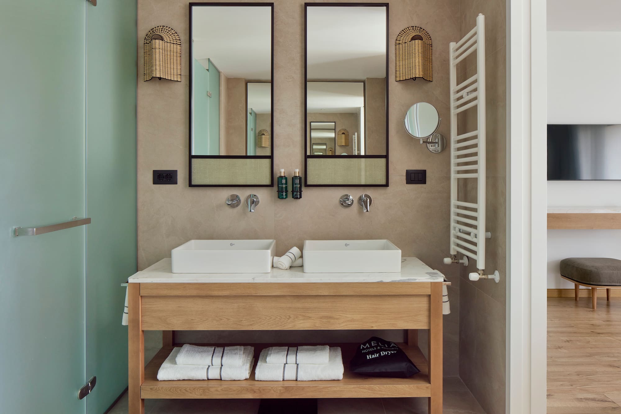 a bathroom with two sinks and mirrors
