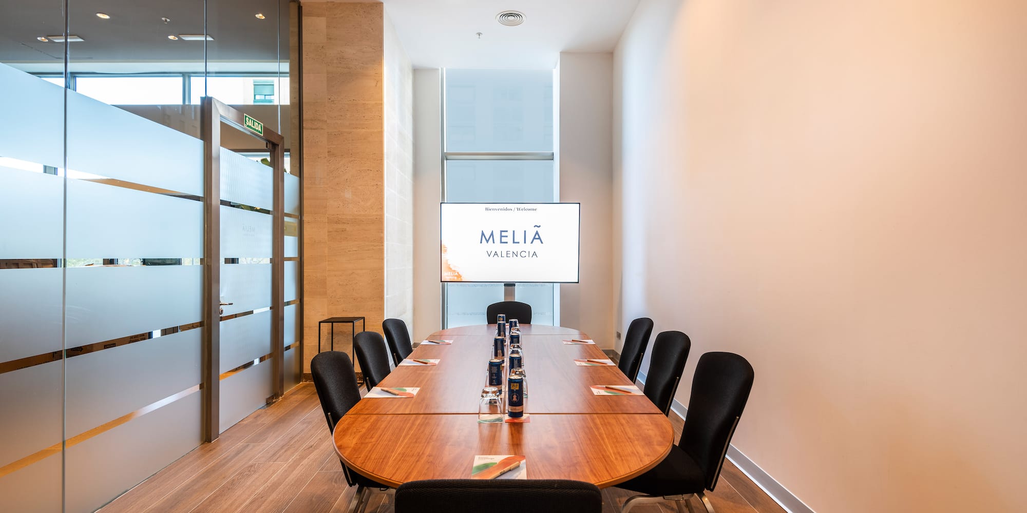 a conference room with a table and chairs