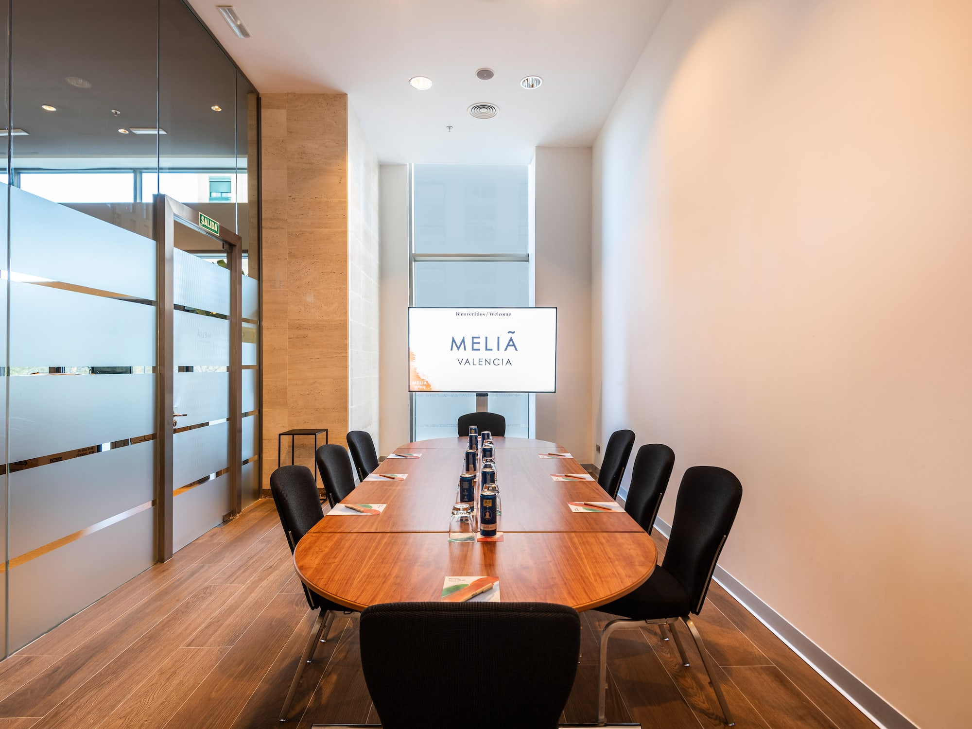 a conference room with a table and chairs