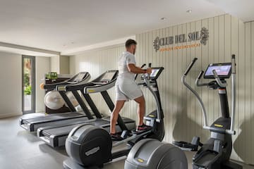 a man on a treadmill in a gym