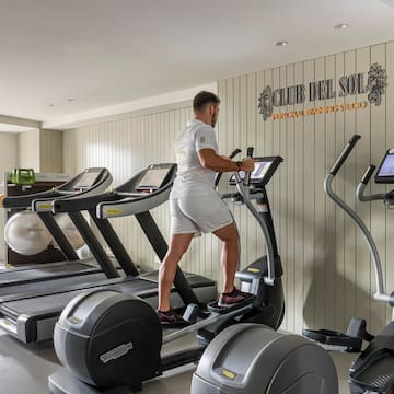 a man on a treadmill in a gym