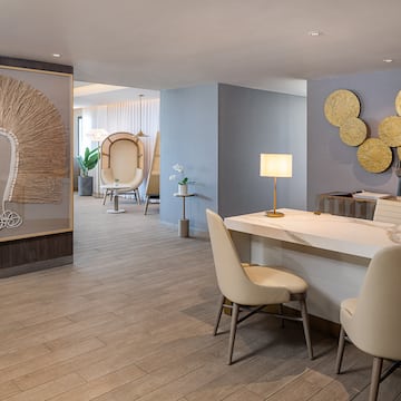 a room with a table and chairs