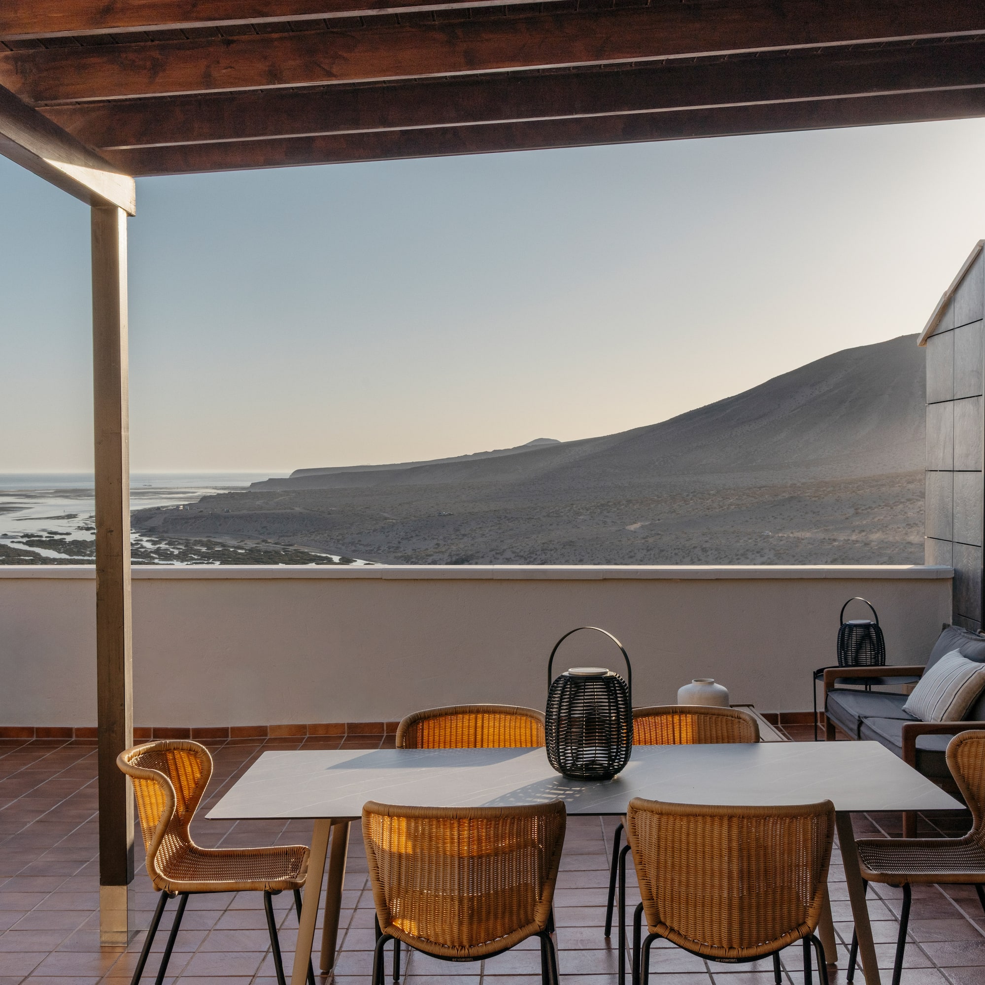 a patio with a table and chairs