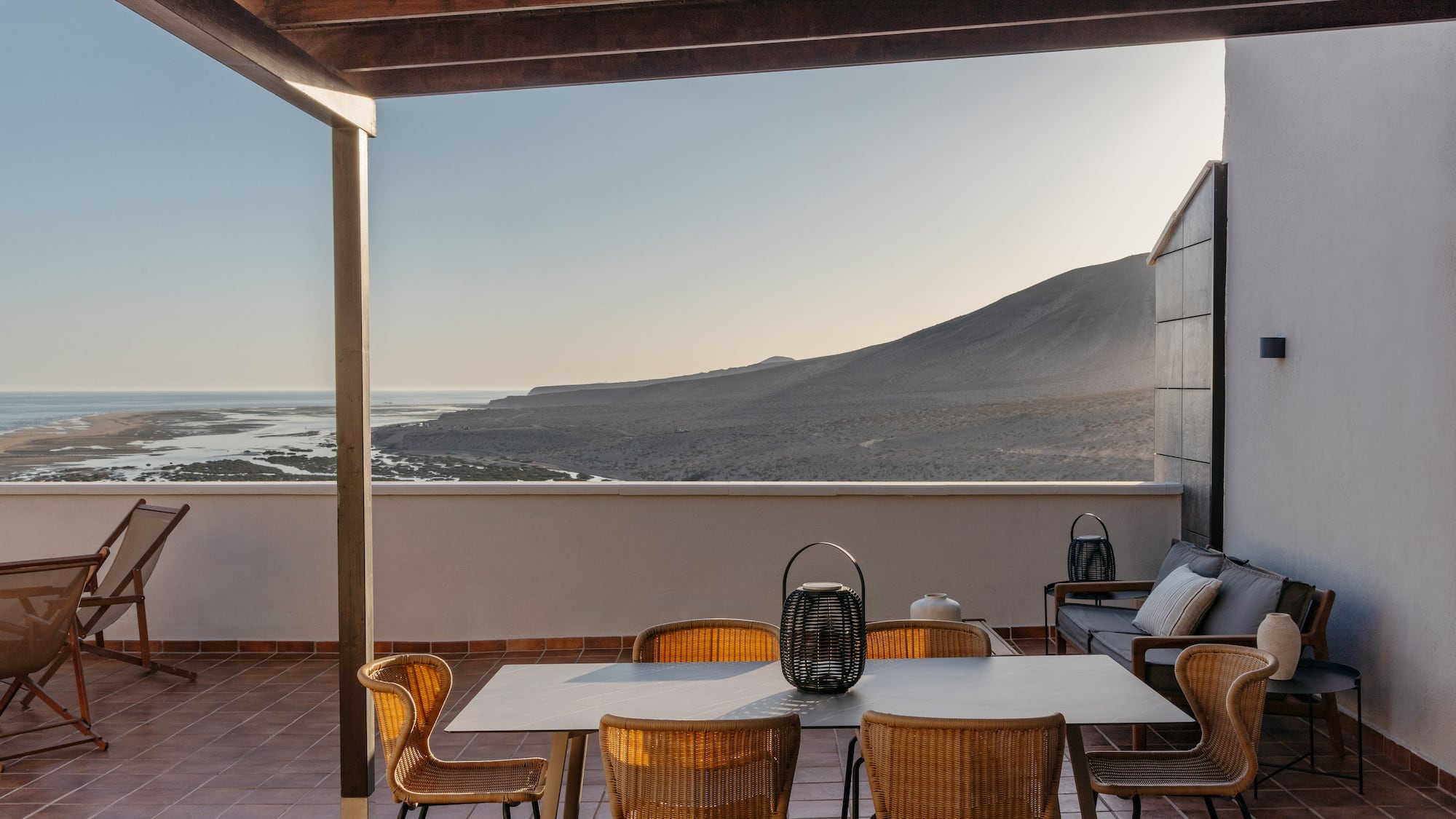 a patio with a table and chairs