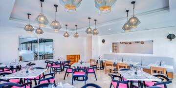 a room with tables and chairs