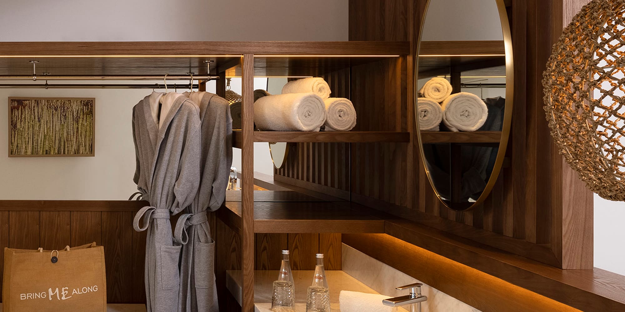 a bathroom with a mirror and towels