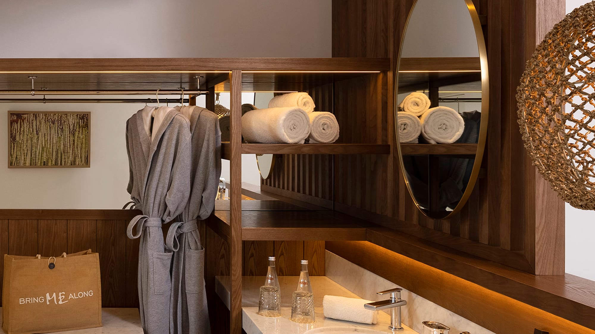 a bathroom with a mirror and towels