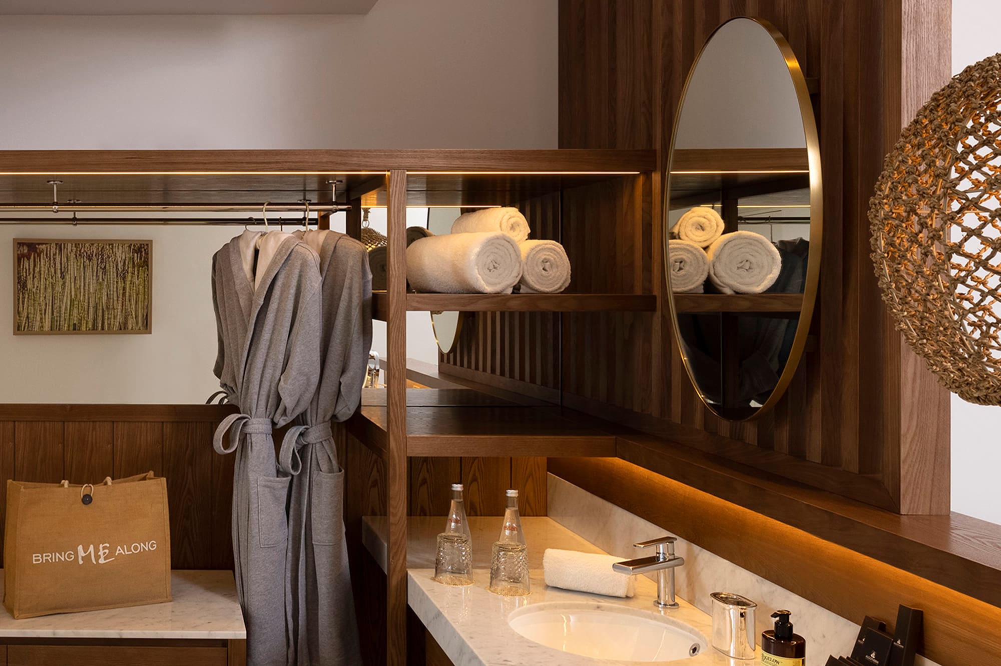 a bathroom with a mirror and towels