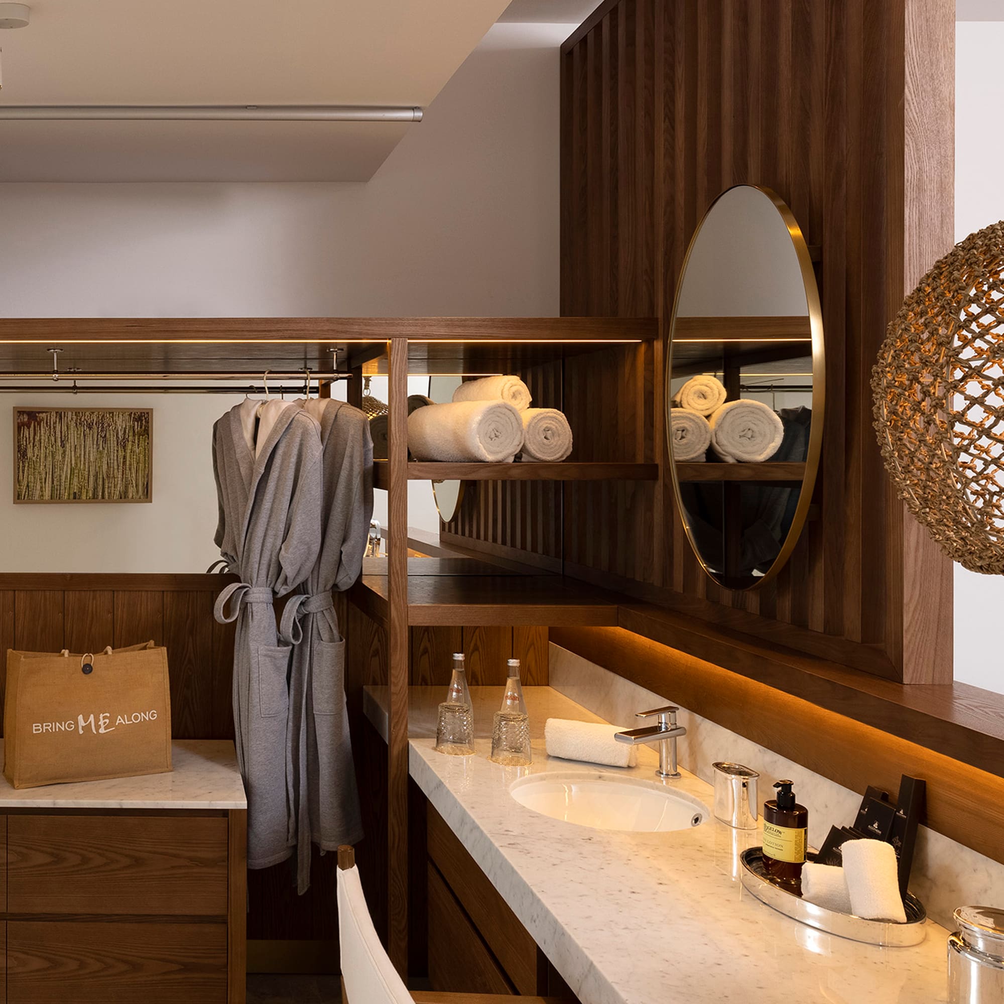 a bathroom with a mirror and towels