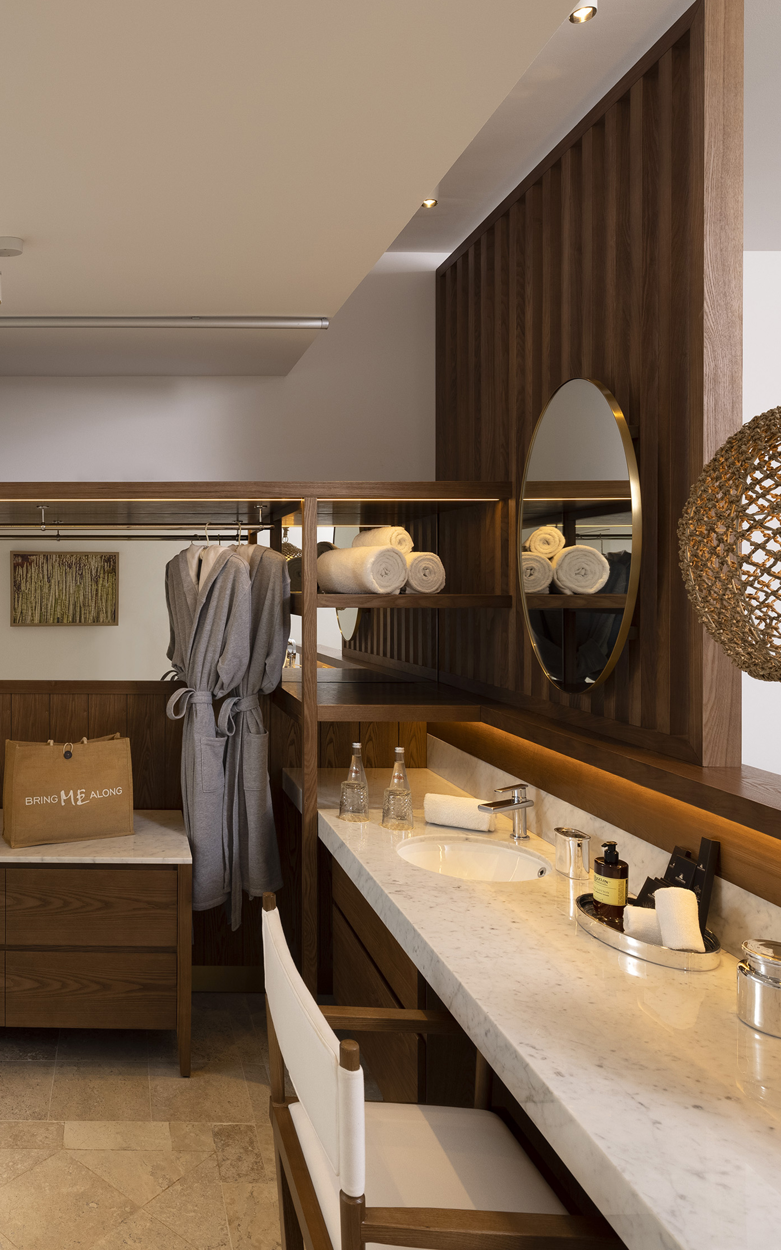 a bathroom with a mirror and towels