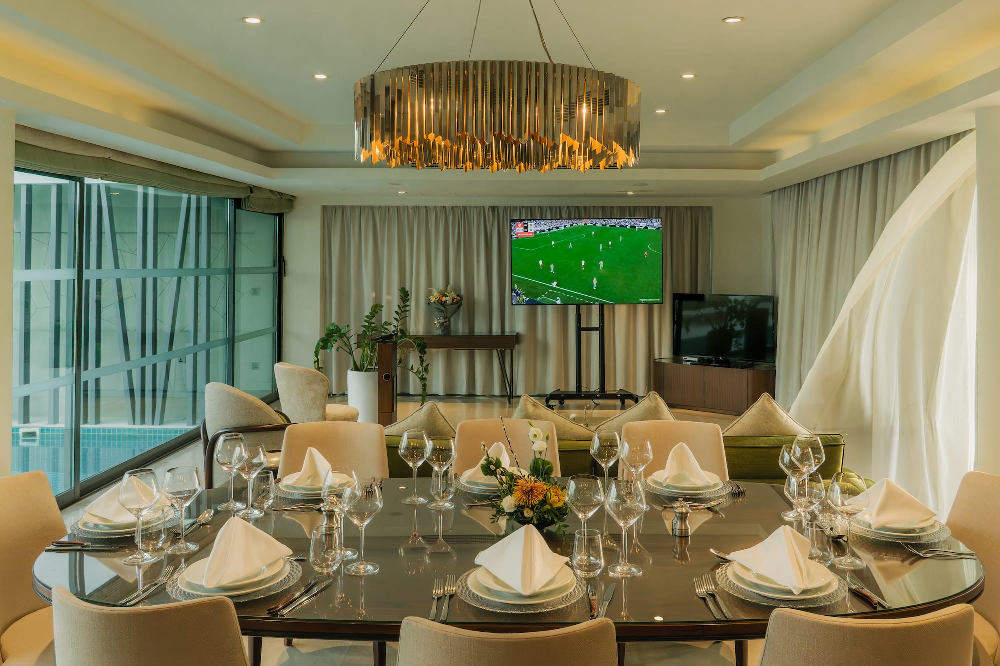 a room with a table set for a dinner party