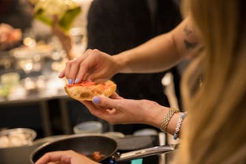 a person holding a piece of bread