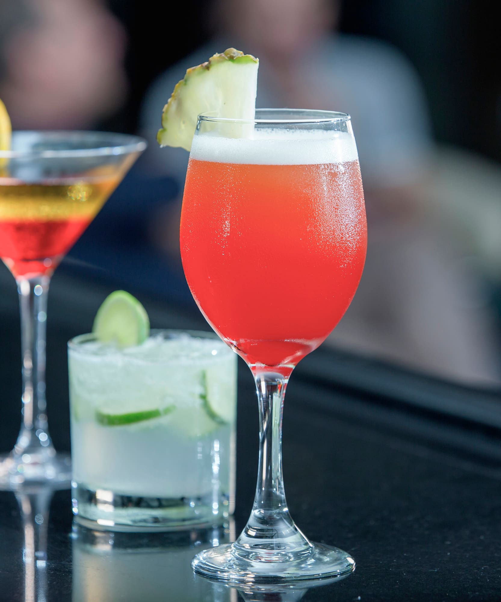 a group of drinks on a bar