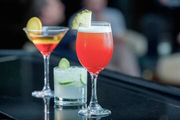 a group of drinks on a bar