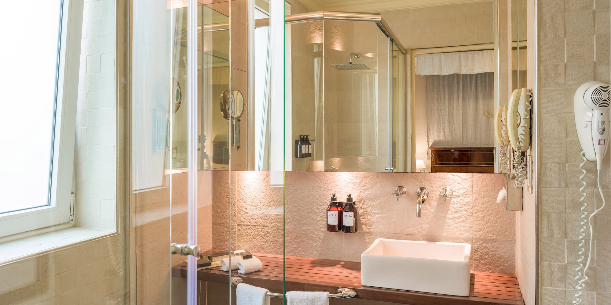 a bathroom with glass shower doors