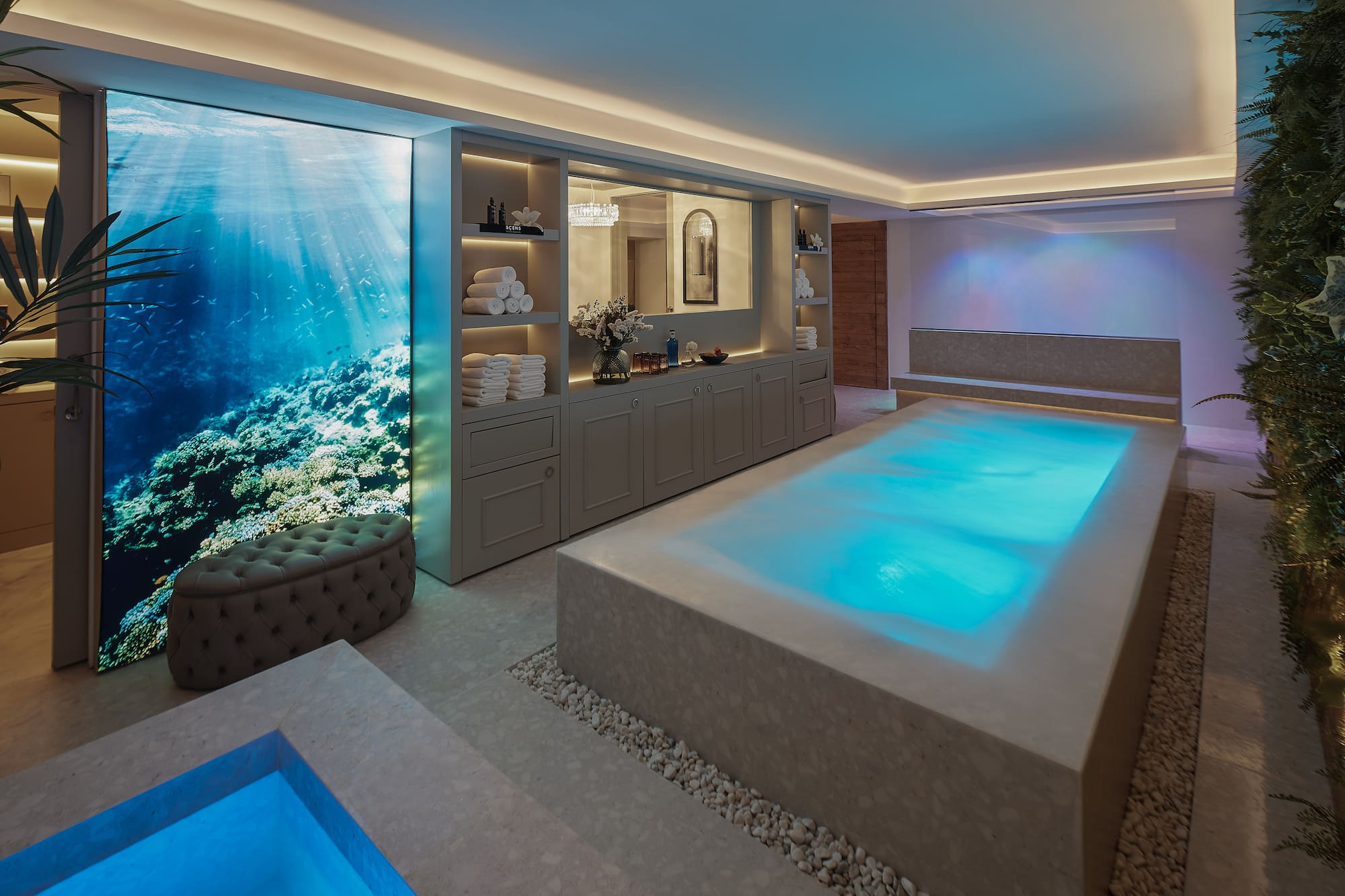 a room with a pool and a large window