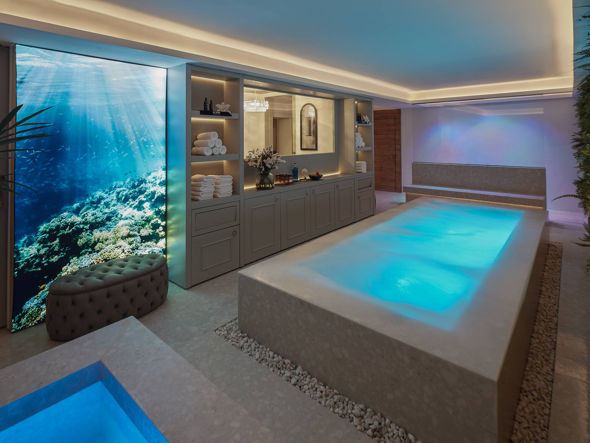 a room with a pool and a large window