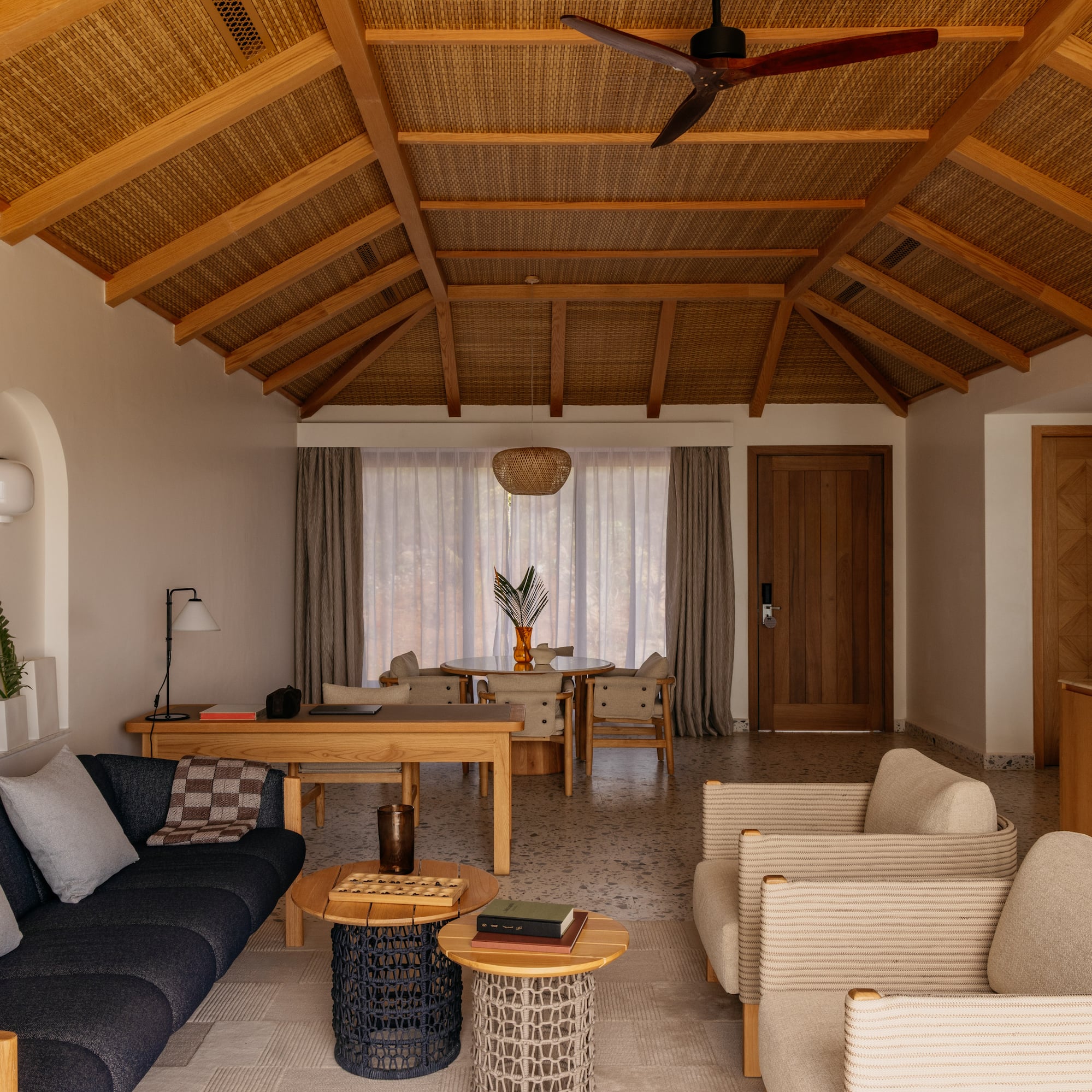 a living room with a couch and chairs