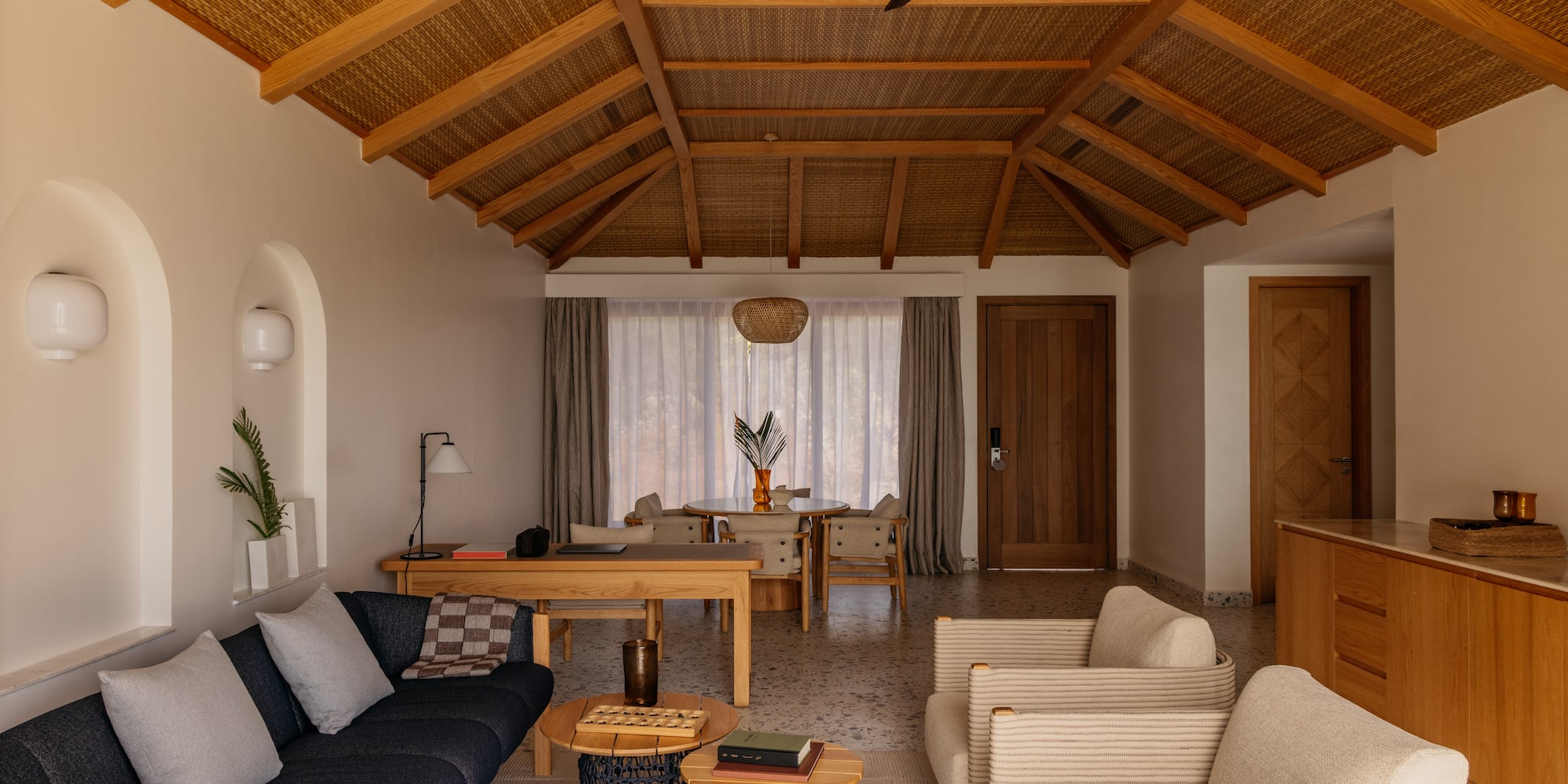 a living room with a couch and chairs