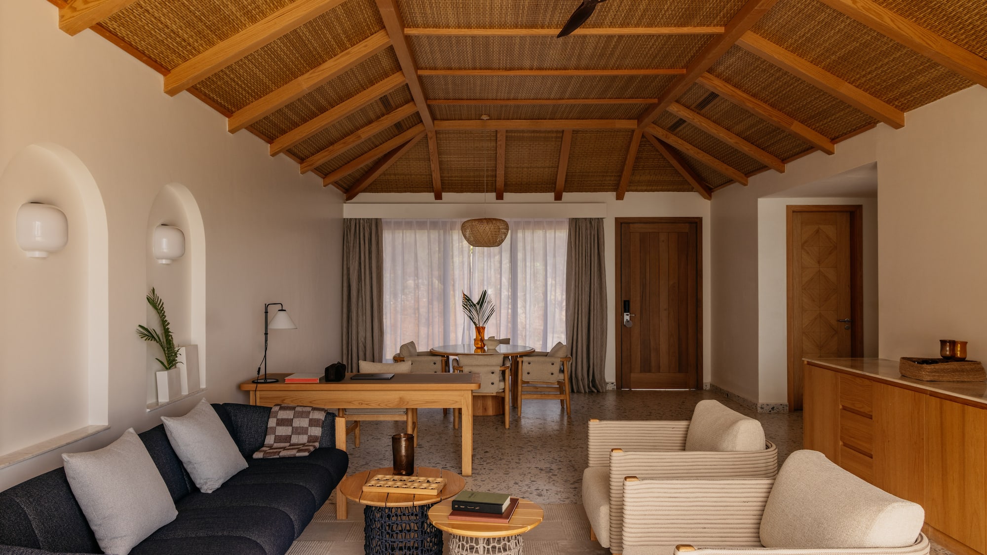 a living room with a couch and chairs