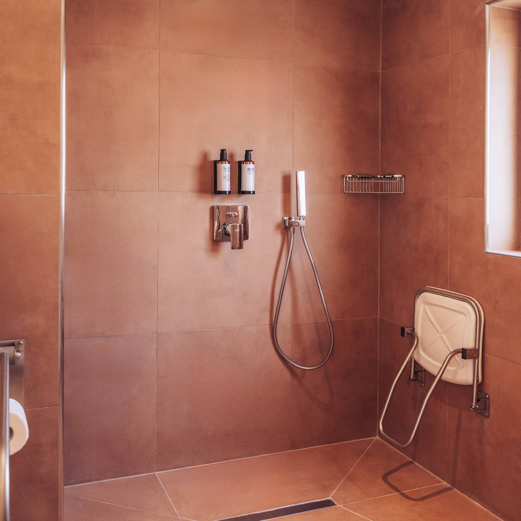 a shower with a shower head and a shower head