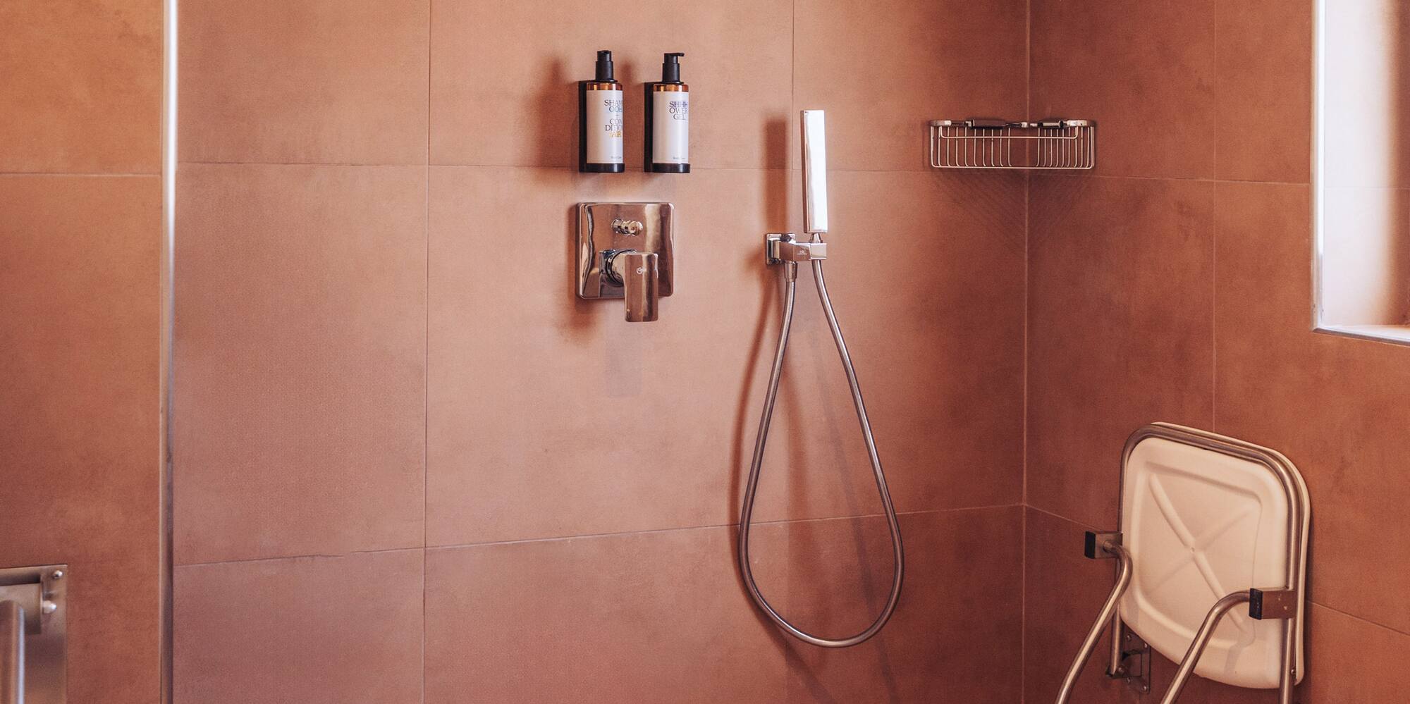 a shower with a shower head and a shower head