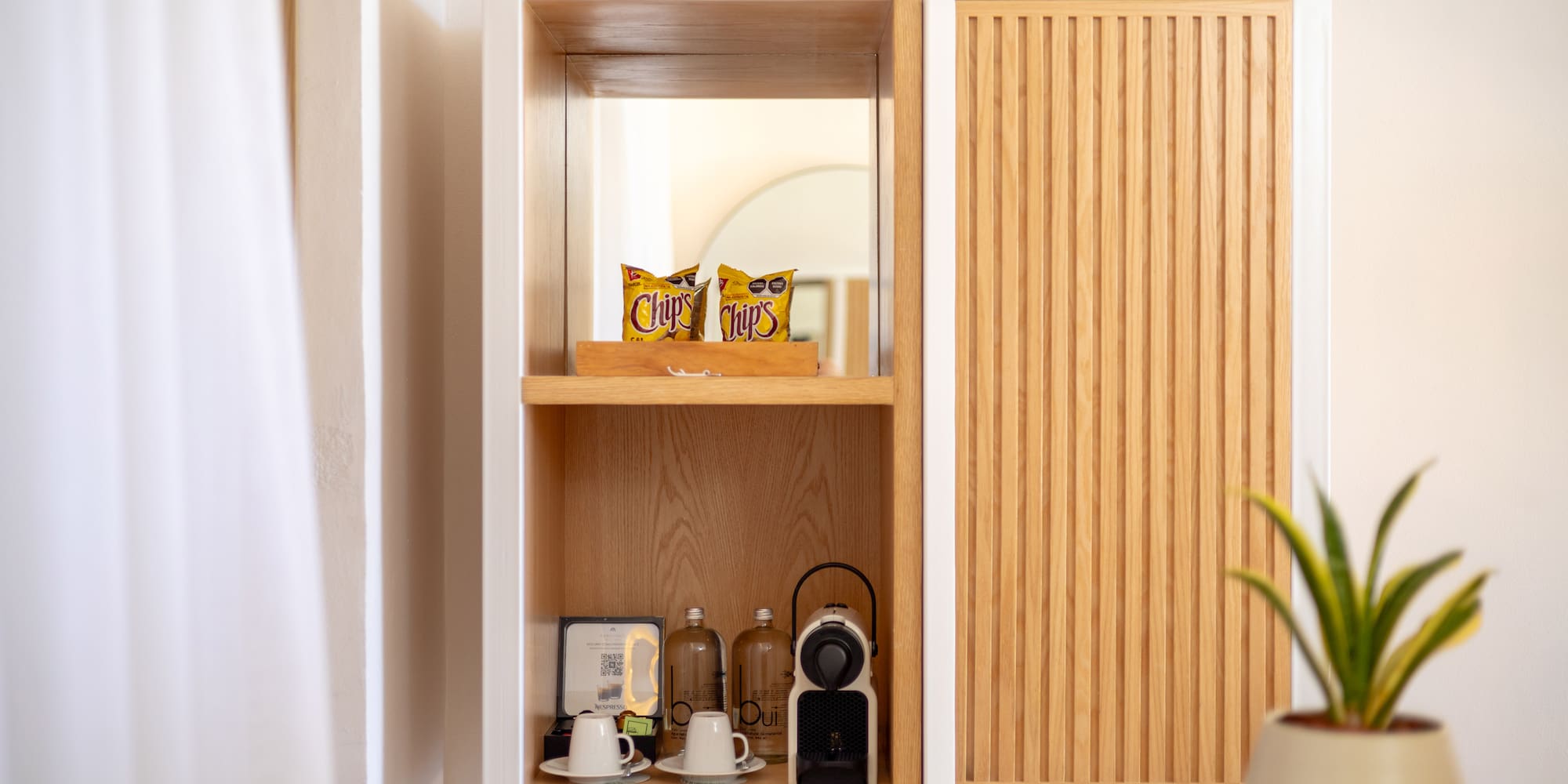 a shelf with a white cabinet and a white wall