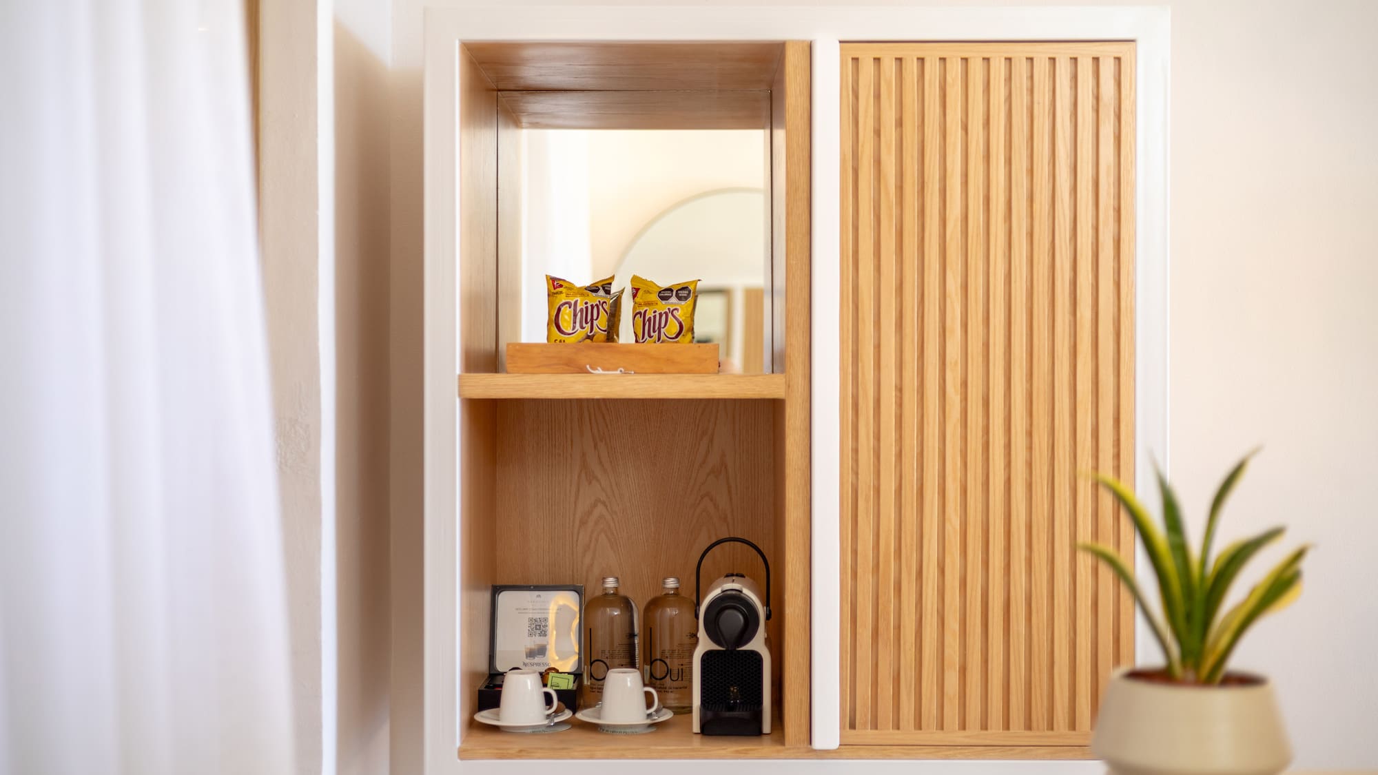 a shelf with a white cabinet and a white wall