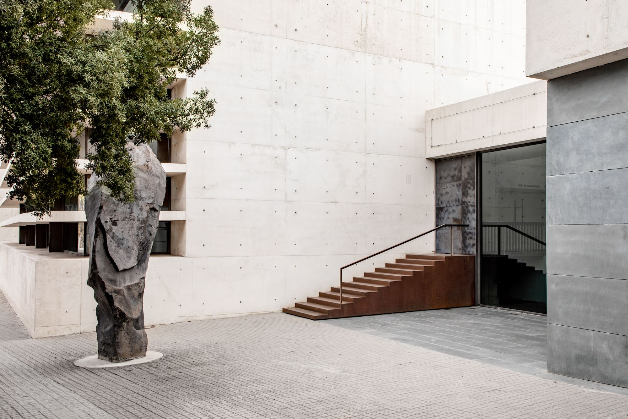 a tree next to a building