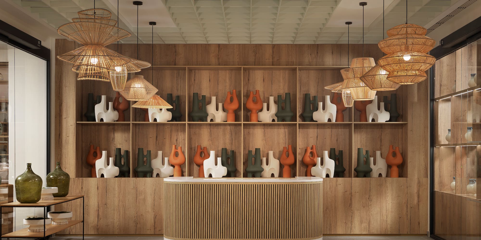 a counter with vases on shelves