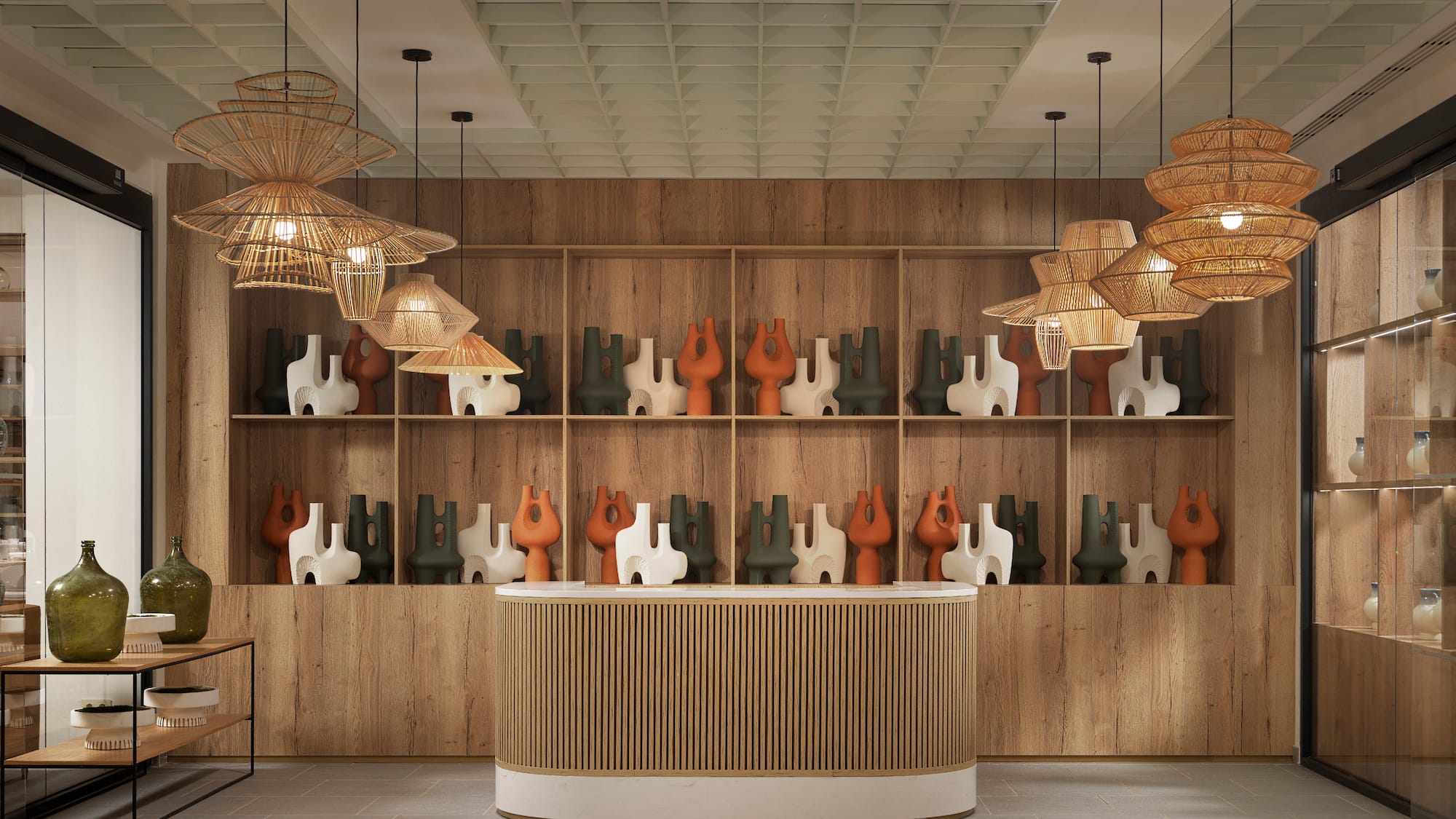 a counter with vases on shelves