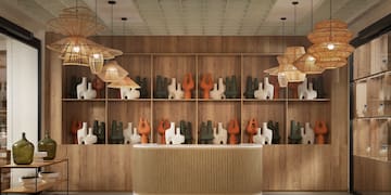 a counter with vases on shelves