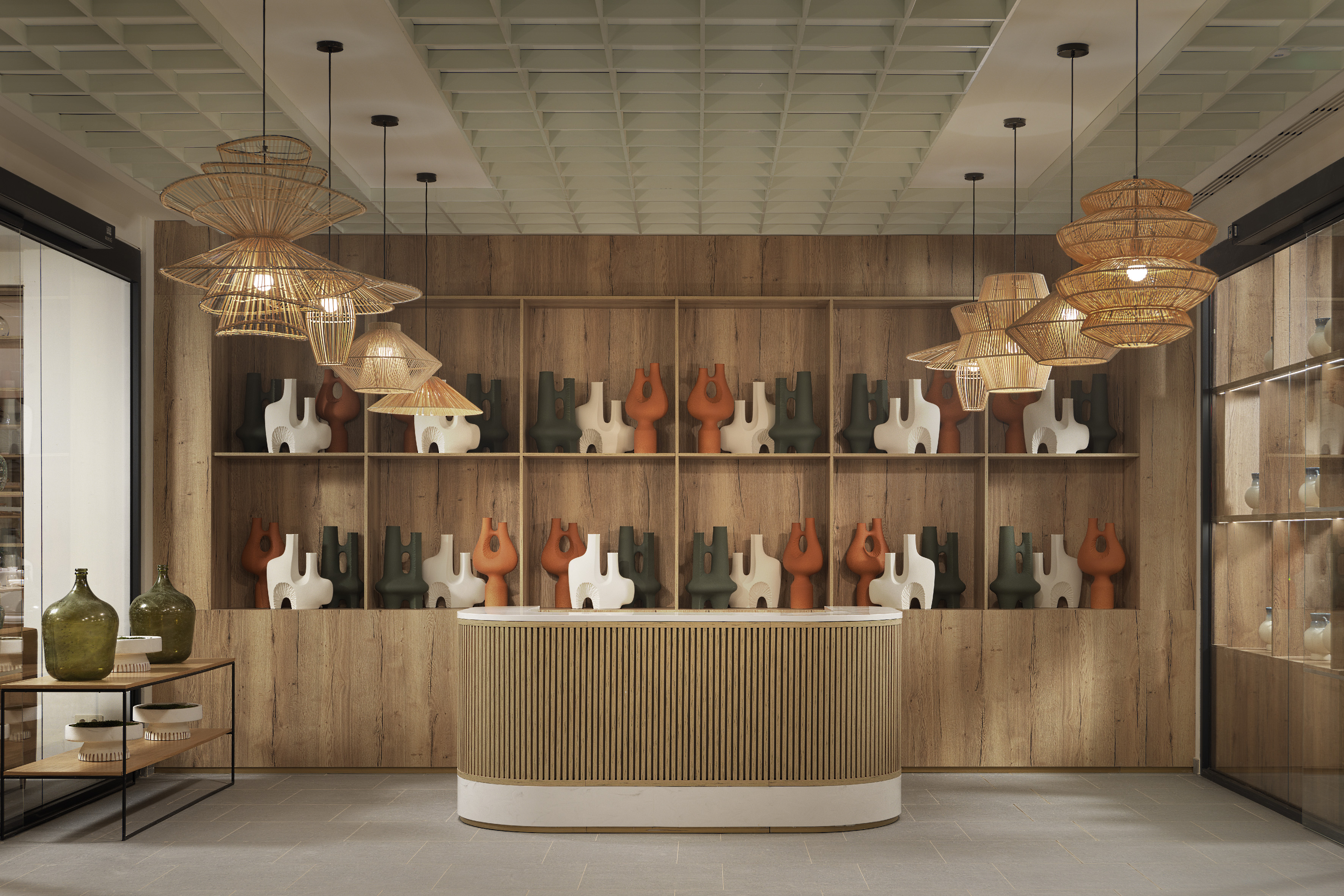 Modern showroom with abstract vases on wooden display, rattan pendant lights.
