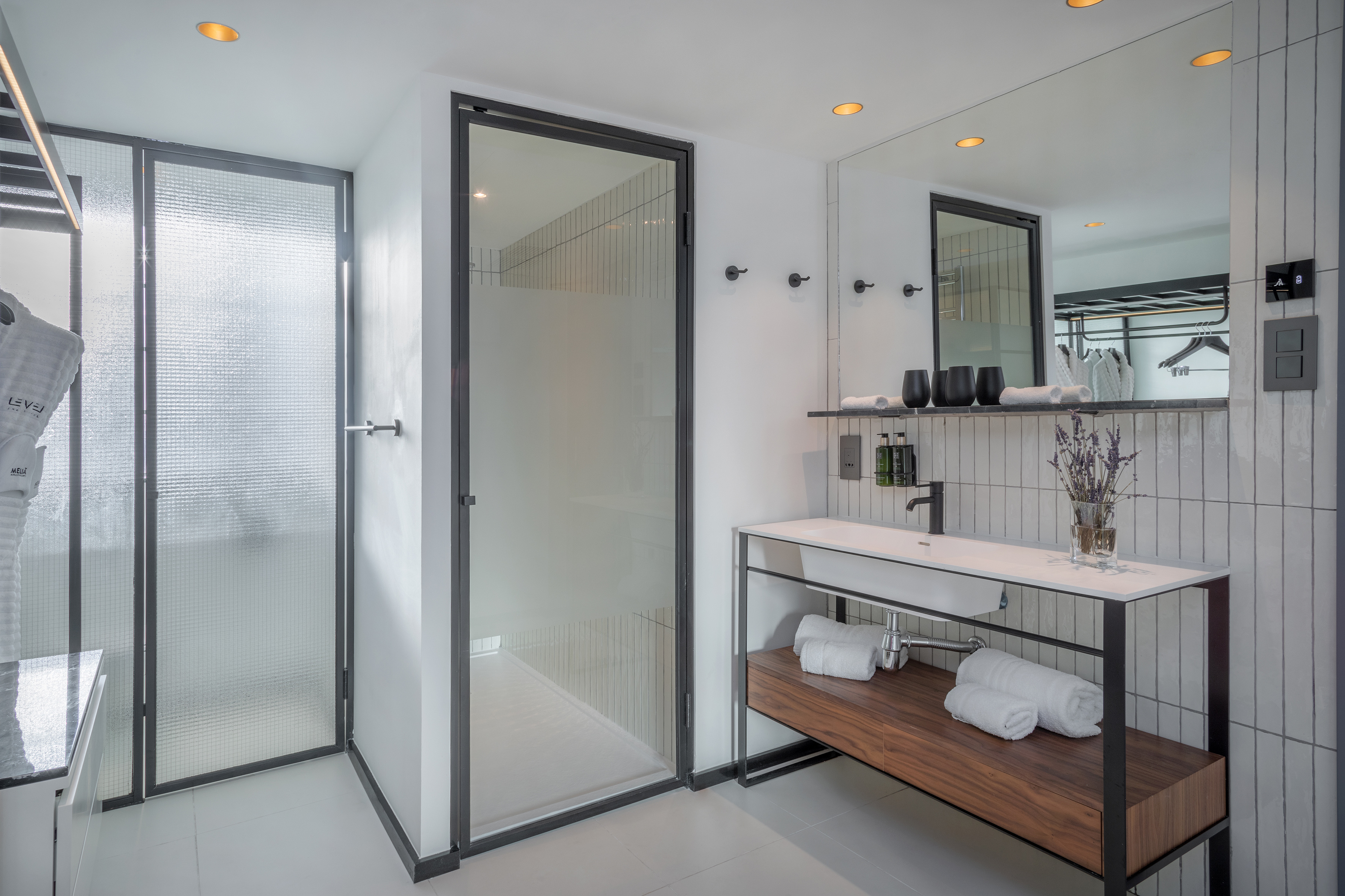 a bathroom with a shower and sink