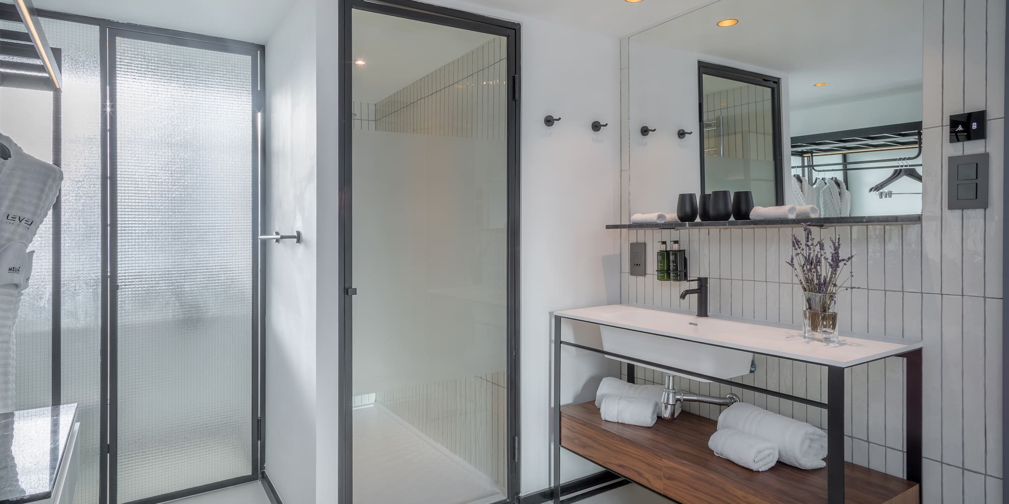 a bathroom with a shower and sink