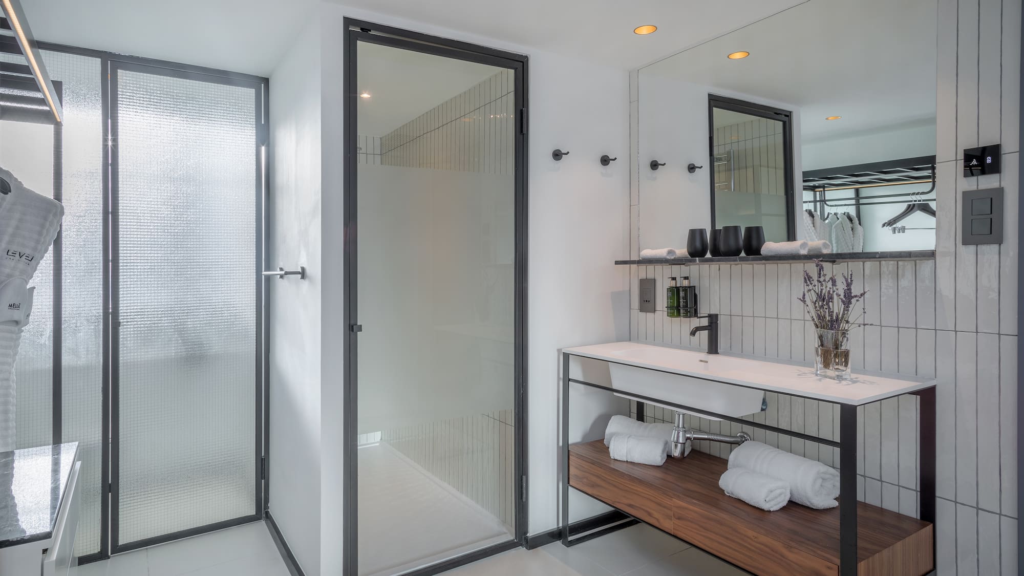 a bathroom with a shower and sink