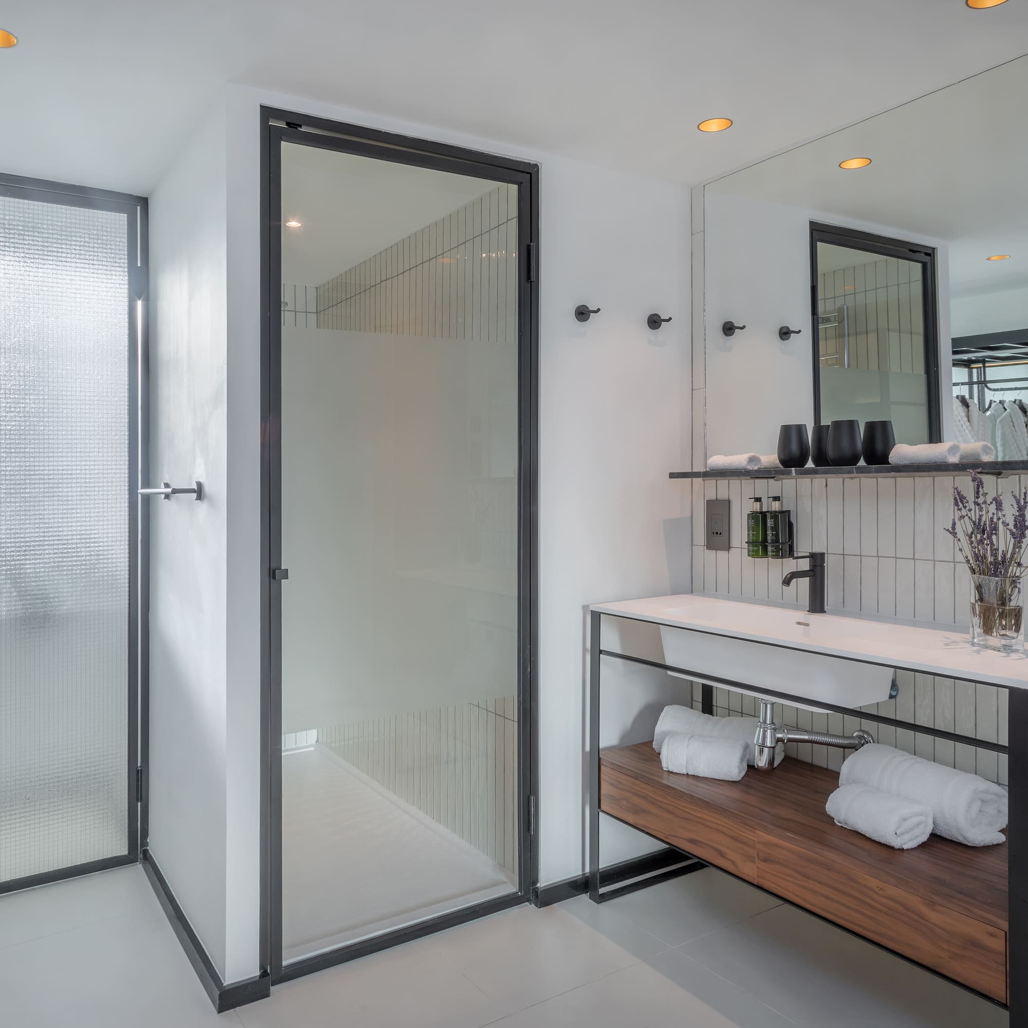 a bathroom with a shower and sink