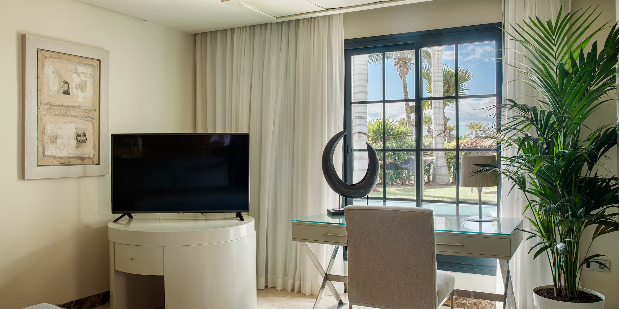 a room with a television and a window