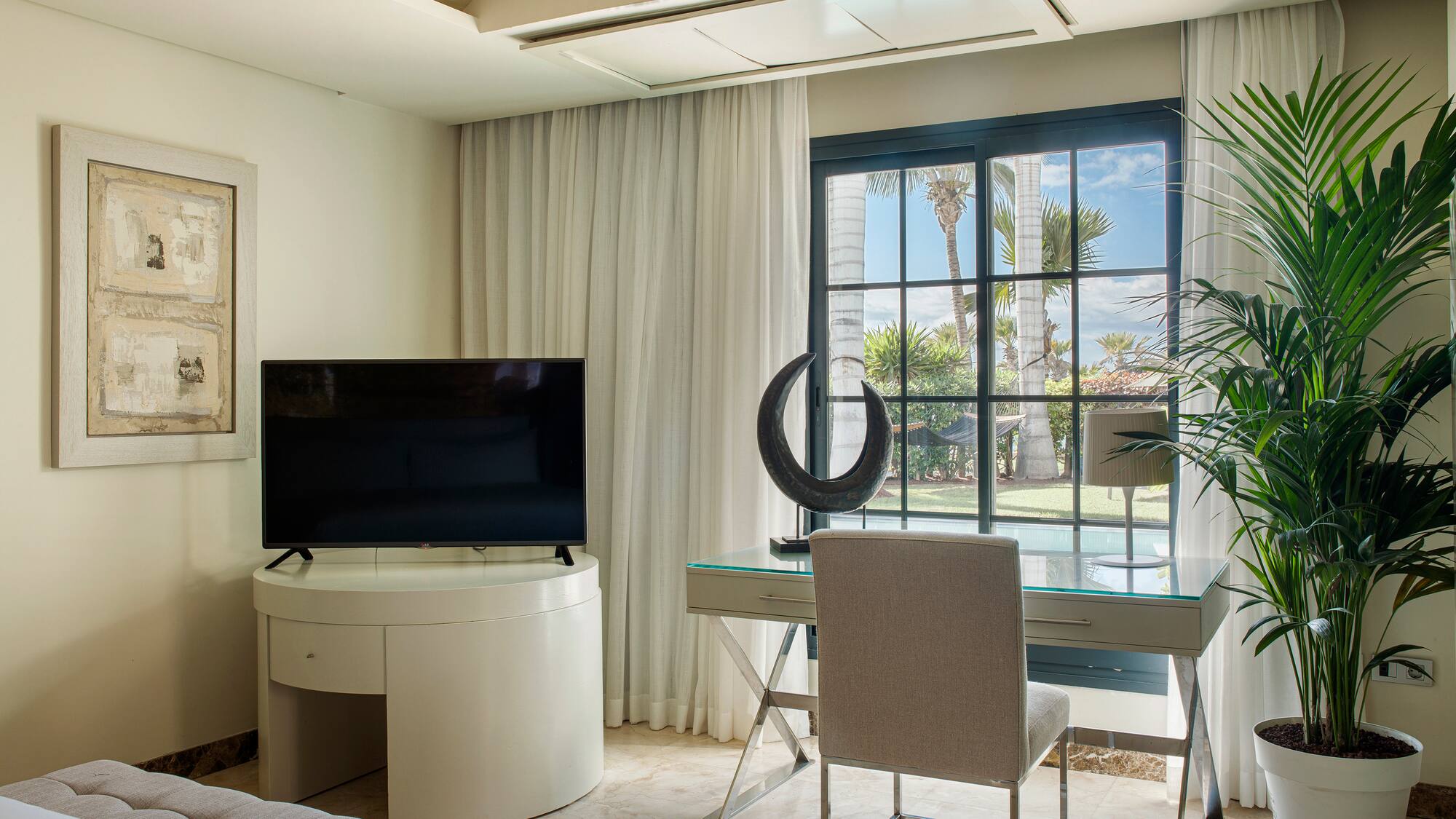 a room with a television and a window