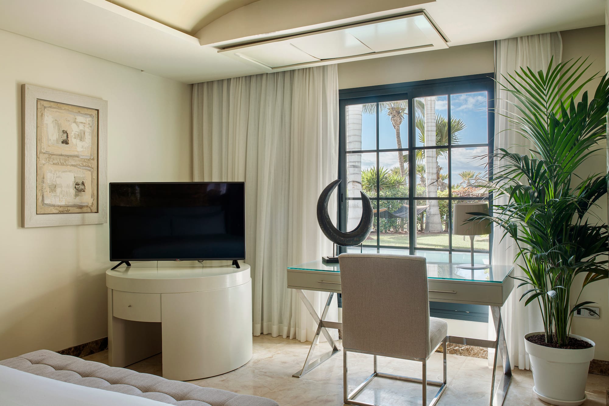 a room with a television and a window