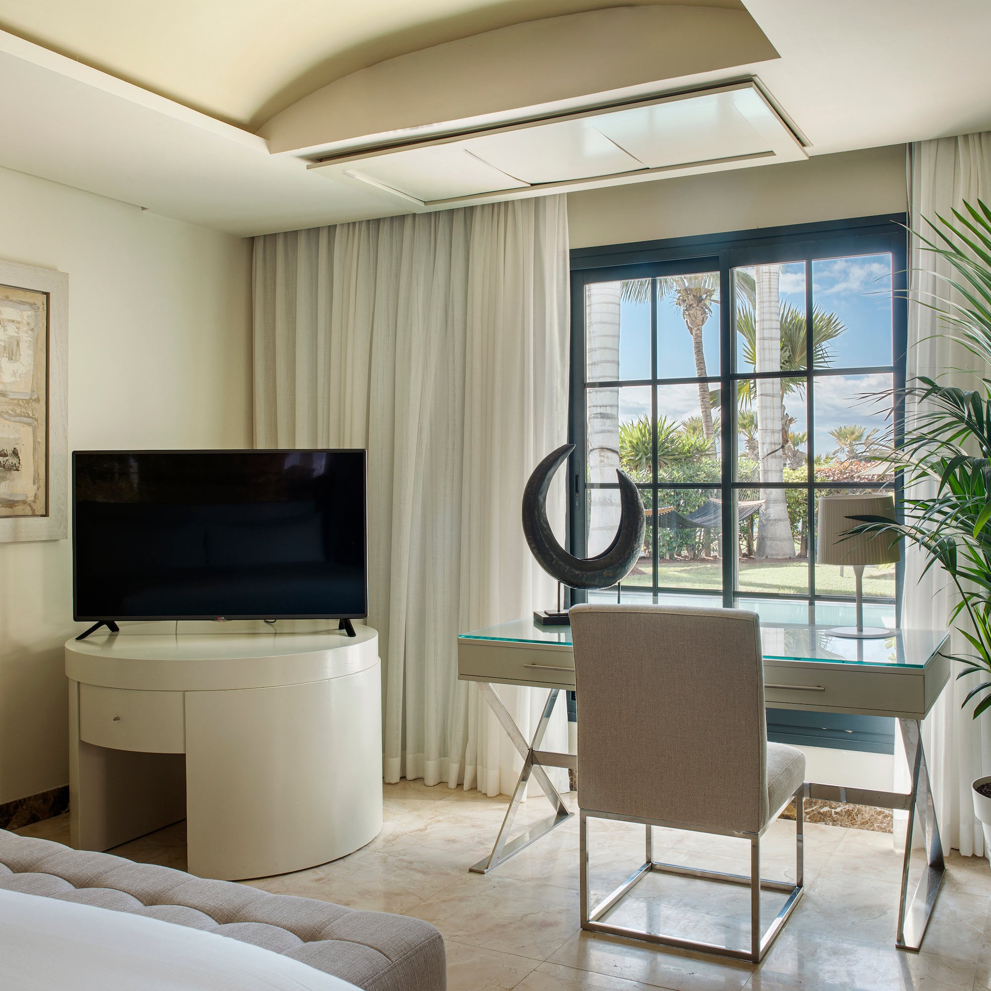 a room with a television and a window